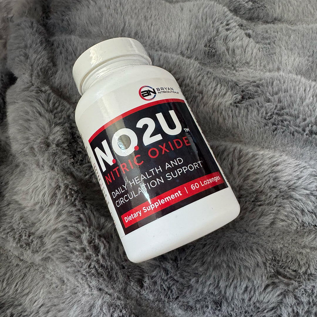NO2U nitric oxide lozenge supplement bottle laying on a fur grey blanket