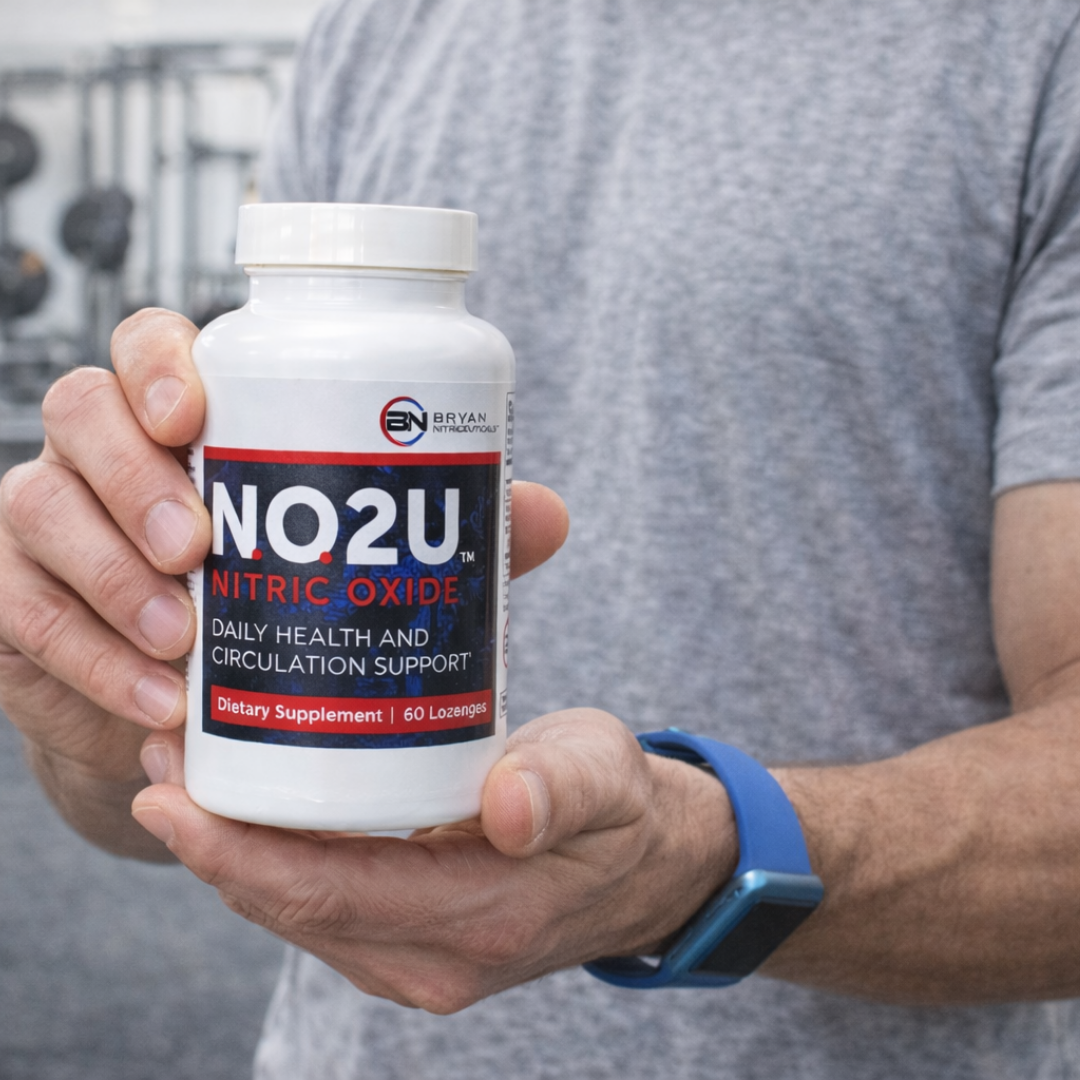 Man holding a bottle of NO2U Nitric Oxide supplement