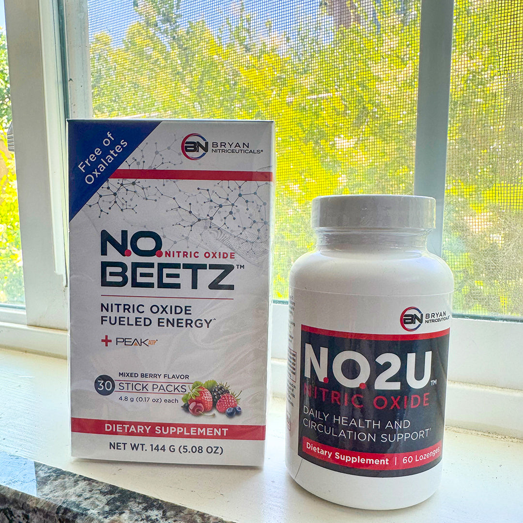 NO Beetz and NO2U Lozenge dietary supplement on a windowsill with a blurred outdoor background.