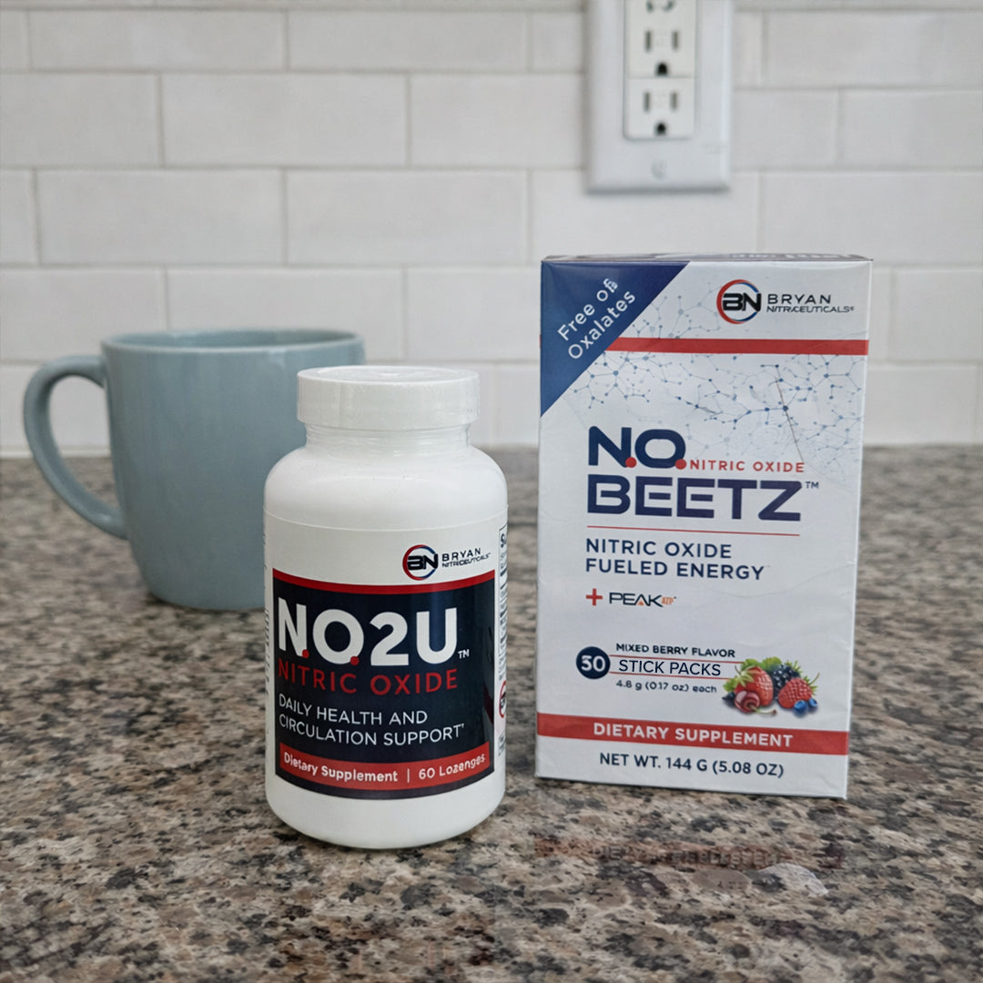 Nitric Oxide supplement bottles and packaging on a kitchen counter