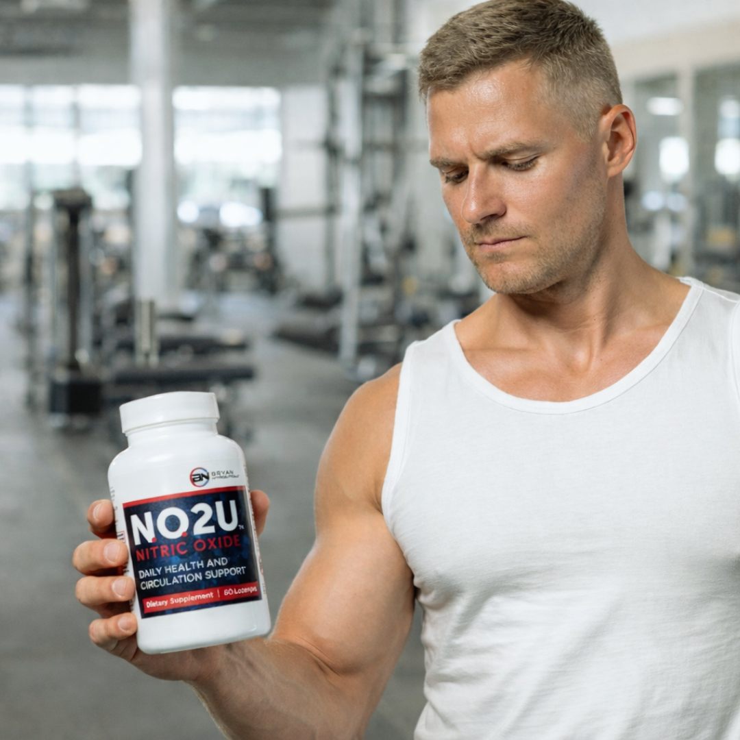 Man holding a supplement bottle labeled 'NO2U' in a gym setting