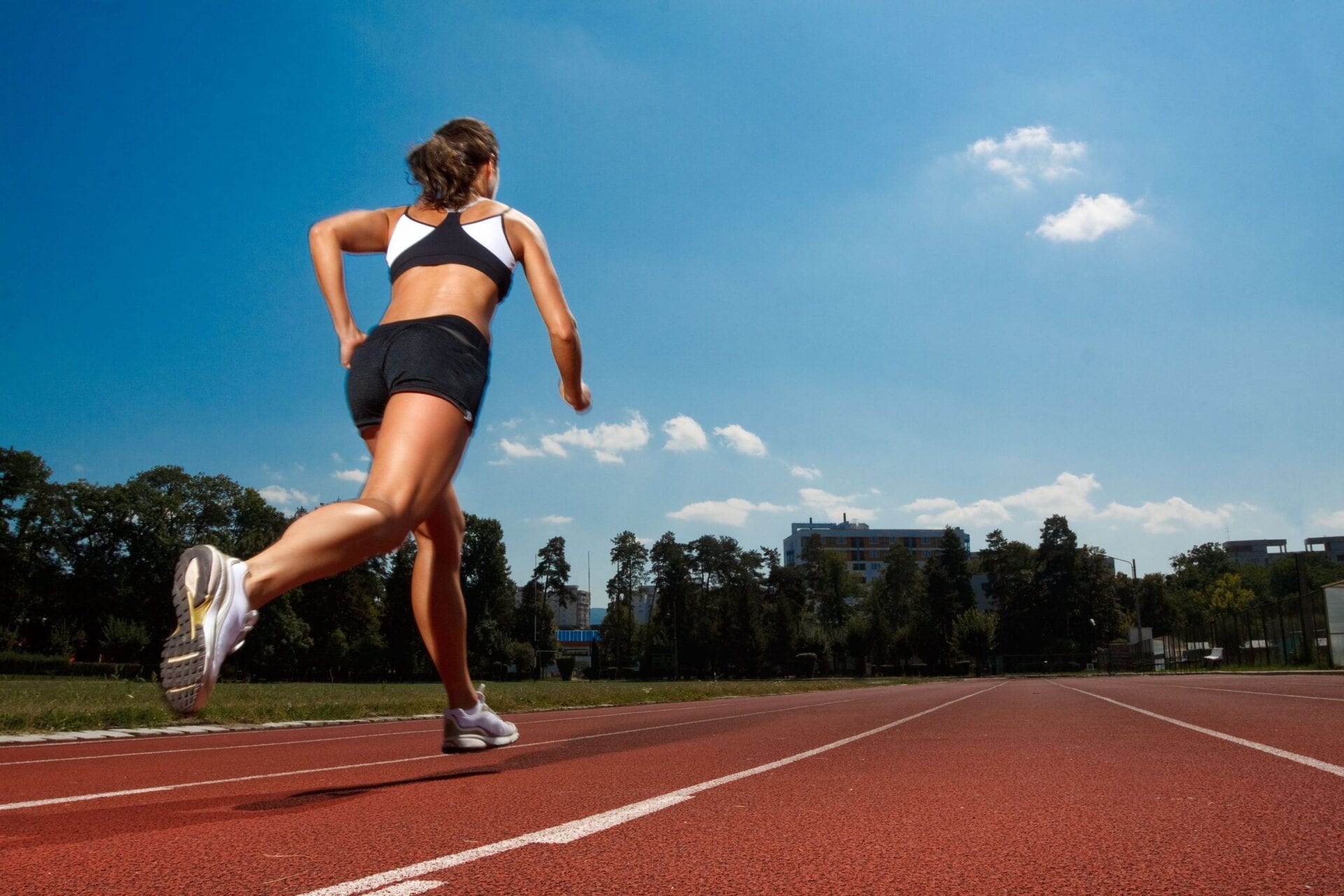 athletic woman running on track
